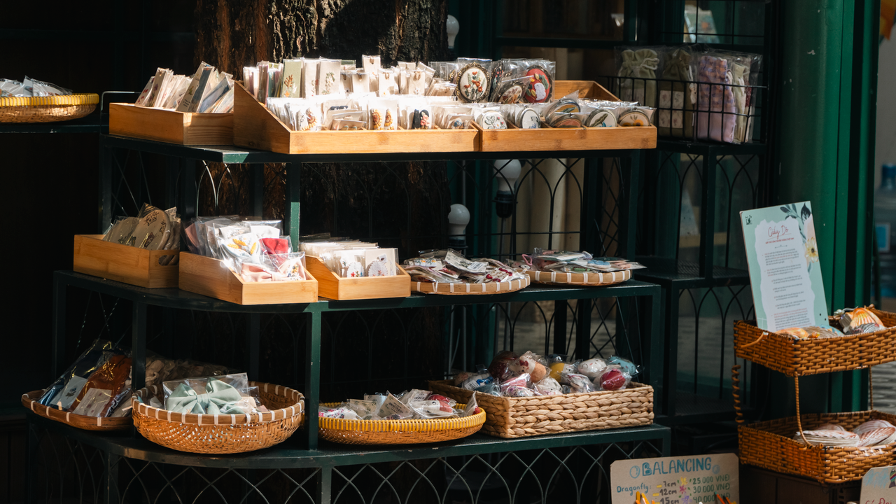 best-selling product-02 Explore handcrafted goods displayed outdoors at a cozy market stall.